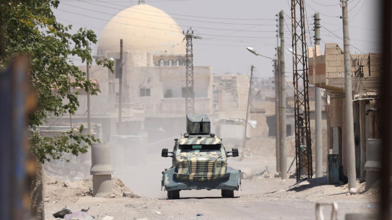A military vehicle of SDF in west of Raqqa province,Syria June 18, 2017.REUTERS/ Rodi Said - RTS17L2S