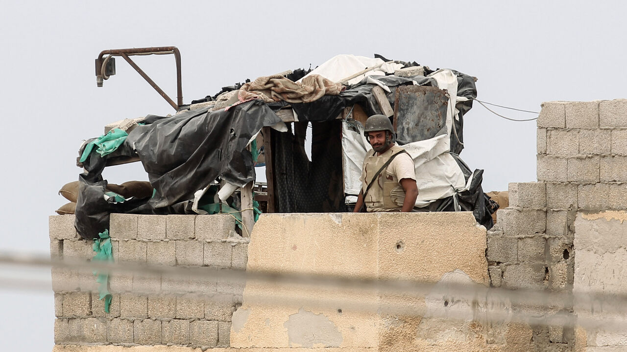 A picture taken from the southern Gaza Strip town of Rafah shows a member of the Egyptian forces standing guard near the border between Gaza and Egypt on August 17, 2017.

A suicide bomber killed a Hamas guard in southern Gaza, officials said, in what was seen as a rare Islamist attack against the Palestinian group that has run the impoverished enclave for a decade. / AFP PHOTO / SAID KHATIB        (Photo credit should read SAID KHATIB/AFP/Getty Images)
