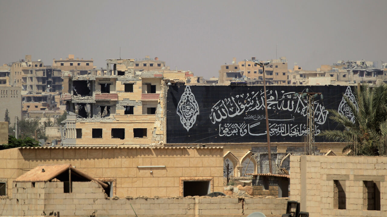 A banner belonging to Islamic States fighters is seen during a battle with member of the Syrian Democratic Forces in Raqqa, Syria August 16, 2017. REUTERS/Zohra Bensemra - RTS1C16D