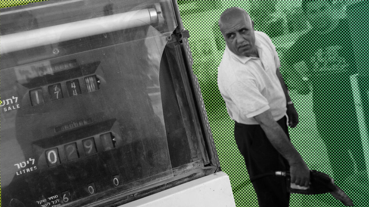 HAWARRA, WEST BANK - MAY 11:  Palestinian gas station manager Hammad Damedi fills 18-liter plastic containers with 96-octane petrol as his fuel stocks are on the point of running out May 11, 2006 in the West Bank village of Hawarra. Petrol stations across the West Bank and the Gaza Strip began closing their pumps after their Israeli supplier cut off deliveries over the Palestinian government's failure to pay its fuel bills. (Photo by David Silverman/Getty Images)