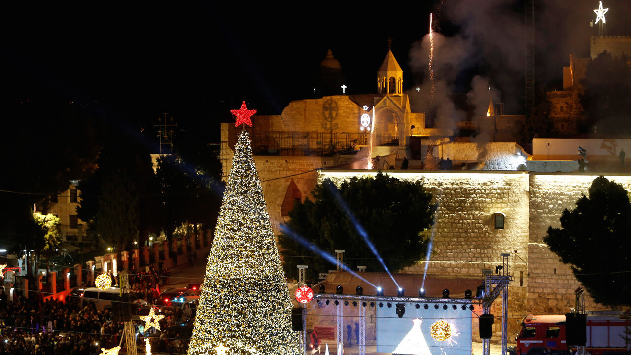 Fireworks explode during a Christmas tree lighting ceremony outside the Church of the Nativity in the West Bank town of Bethlehem December 3, 2016. REUTERS/Mussa Qawasma - RC1514D50930