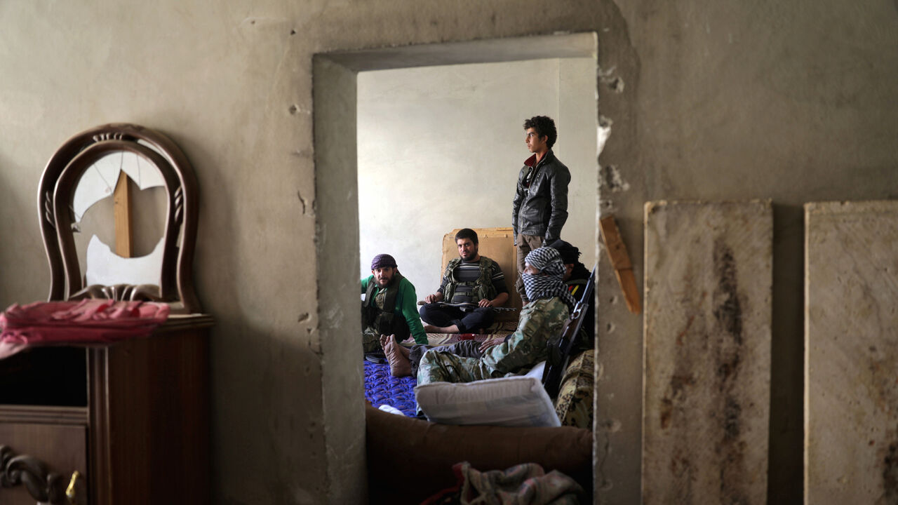 Free Syrian Army fighters sit together in the town of Tadef in Aleppo Governorate, Syria October 23, 2017. REUTERS/Khalil Ashawi - RC19D8DC3BD0