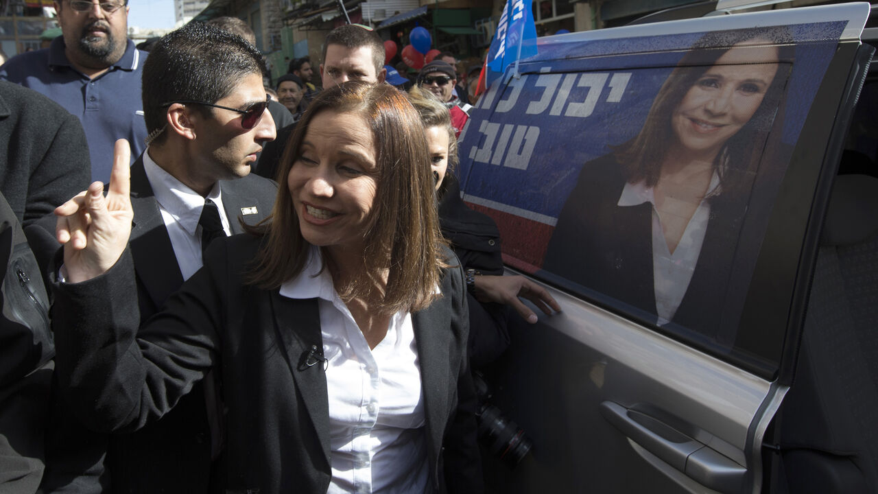 Labour party leader Shelly Yachimovich leaves after campaigning at the Mahne Yehuda market in Jerusalem January 16, 2013. In decline since the peace it sought with the Palestinians unravelled into violence, Israel's Labour Party looks set to regain some lost ground in next week's election after waging an economy-focused campaign. REUTERS/Ronen Zvulun (JERUSALEM - Tags: POLITICS ELECTIONS) - GM1E91G1OP101