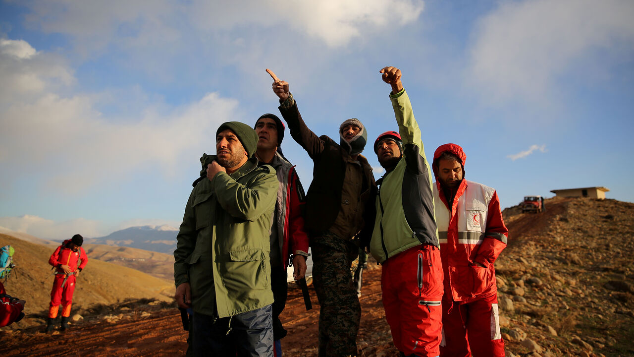 Members of emergency and rescue team search for the plane that crashed in a mountainous area of central Iran, February 19, 2018. REUTERS/Tasnim News Agency  ATTENTION EDITORS - THIS PICTURE WAS PROVIDED BY A THIRD PARTY. - RC18A45E46C0