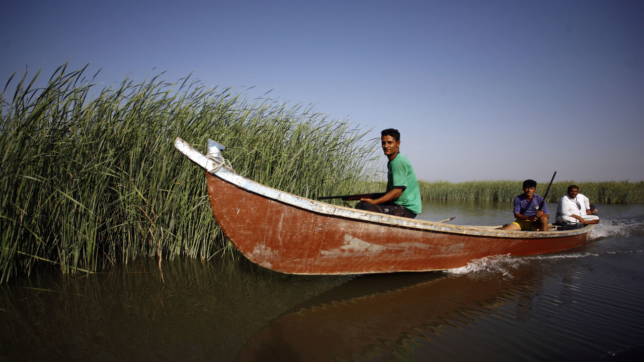 Iraqis hold guns as they hunt at in the Chibayish marshes near the southern Iraqi city of Nassiriyah on September 13, 2016.
UNESCO has named Iraqi marshlands once ravaged by dictator Saddam Hussein as a World Heritage Site, a bright spot for a country where jihadists have repeatedly sought to wipe out history.

 / AFP / Haidar HAMDANI        (Photo credit should read HAIDAR HAMDANI/AFP/Getty Images)