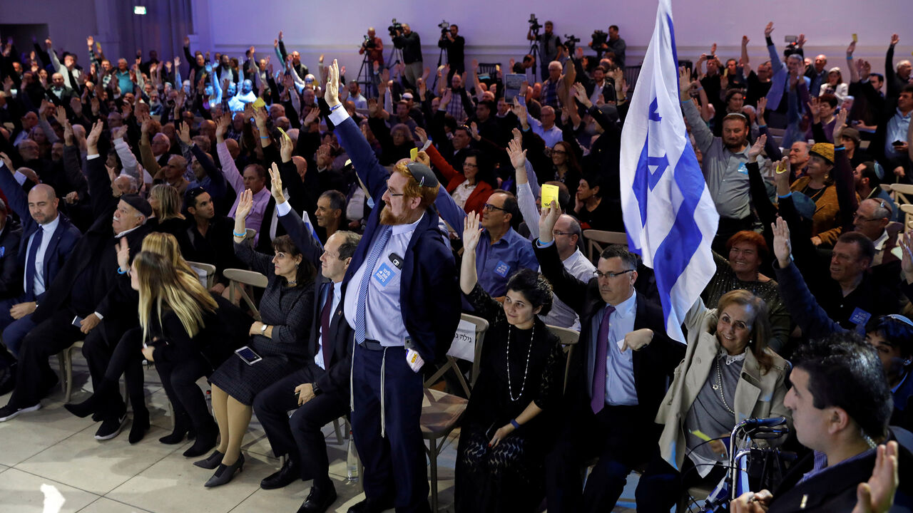Likud party members vote during a Likud Central Committee meeting in Airport City, Israel December 31, 2017. REUTERS/Amir Cohen - RC15A92D2000