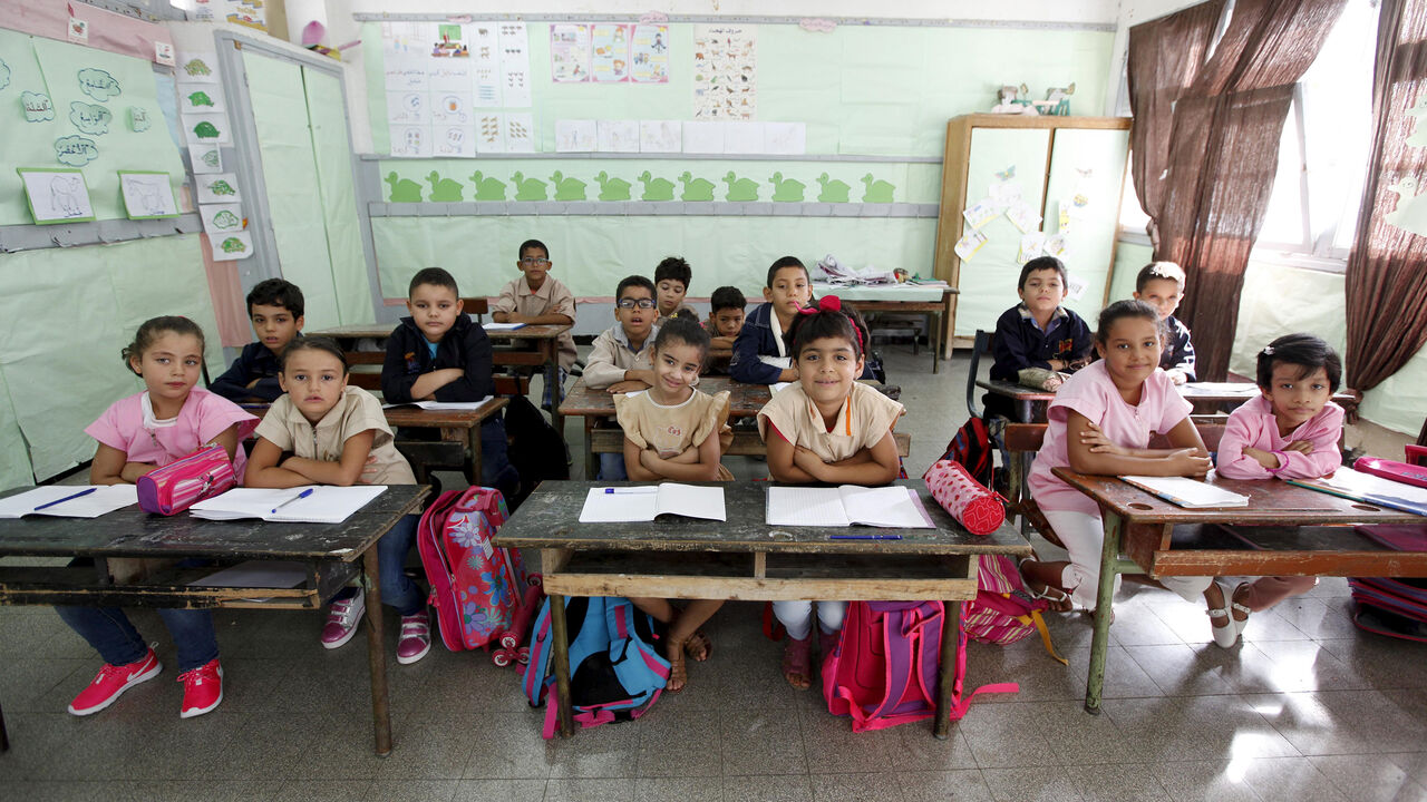 Students cross their arms to demonstrate they are listening carefully to their teacher at Al Hakim El Kassar Primary School in Tunis, Tunisia, September 16, 2015. Schools have reopened, with around 2 million pupils heading back to classrooms after a three-month summer break. Nearly three years after Taliban gunmen shot Pakistani schoolgirl Malala Yousafzai, the teenage activist last week urged world leaders gathered in New York to help millions more children go to school. World Teachers' Day falls on 5 Octo