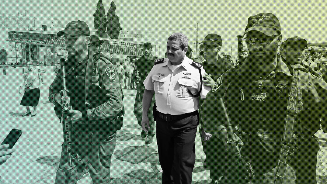 Chief of the Israeli police, Commissioner Roni Alsheikh (C), leaves after speaking to the press at the Western Wall in Jerusalem, on the ongoing tensions surrounding the Al-Aqsa mosque compound on July 27, 2017.  / AFP PHOTO / GALI TIBBON        (Photo credit should read GALI TIBBON/AFP/Getty Images)