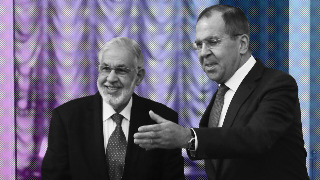 Russia's Foreign Minister Sergei Lavrov shows the way to Libya's Foreign Minister Mohamed Taher Siala during a meeting in Moscow, Russia December 12, 2017. REUTERS/Sergei Karpukhin - UP1EDCC0Q7Q6D