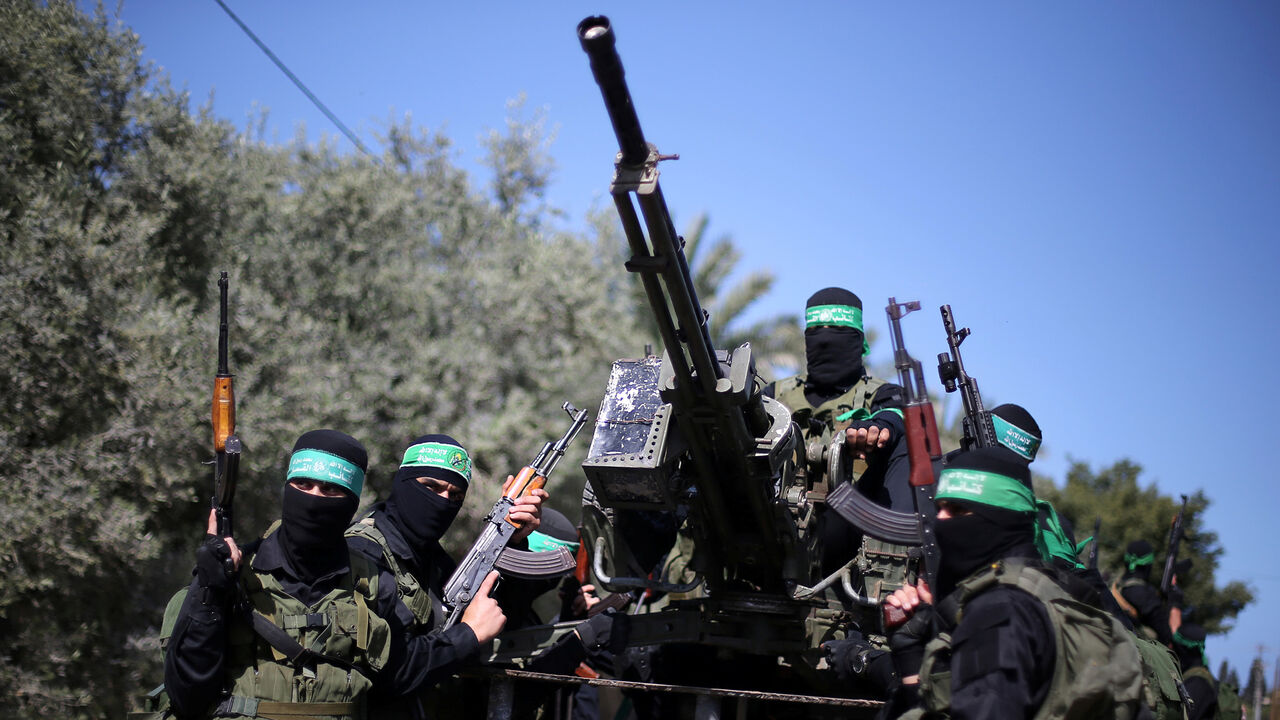 Palestinian Hamas militants attend a military drill in preparation to any upcoming confrontation with Israel, in the southern Gaza Strip March 25, 2018. REUTERS/Ibraheem Abu Mustafa - RC1B884125E0