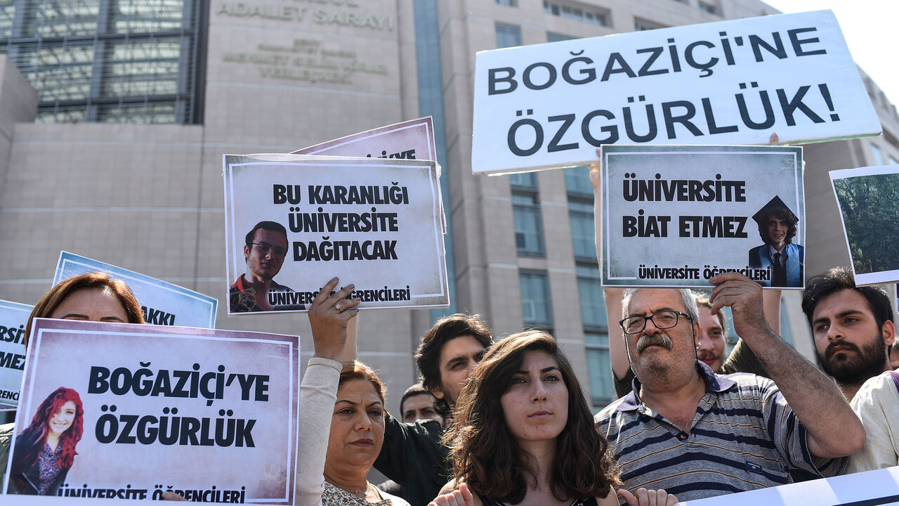 People demonstrate outside the Caglayan courthouse on June 6, 2018 in Istanbul with banners reading "Freedom for Bogazici" as a trial opens today of 21 students from Bogazici University described by Turkey's President as "terrorists" after they opposed the Turkish military operation in Syria launched in January 2018. (Photo by Yasin AKGUL / AFP)        (Photo credit should read YASIN AKGUL/AFP/Getty Images)