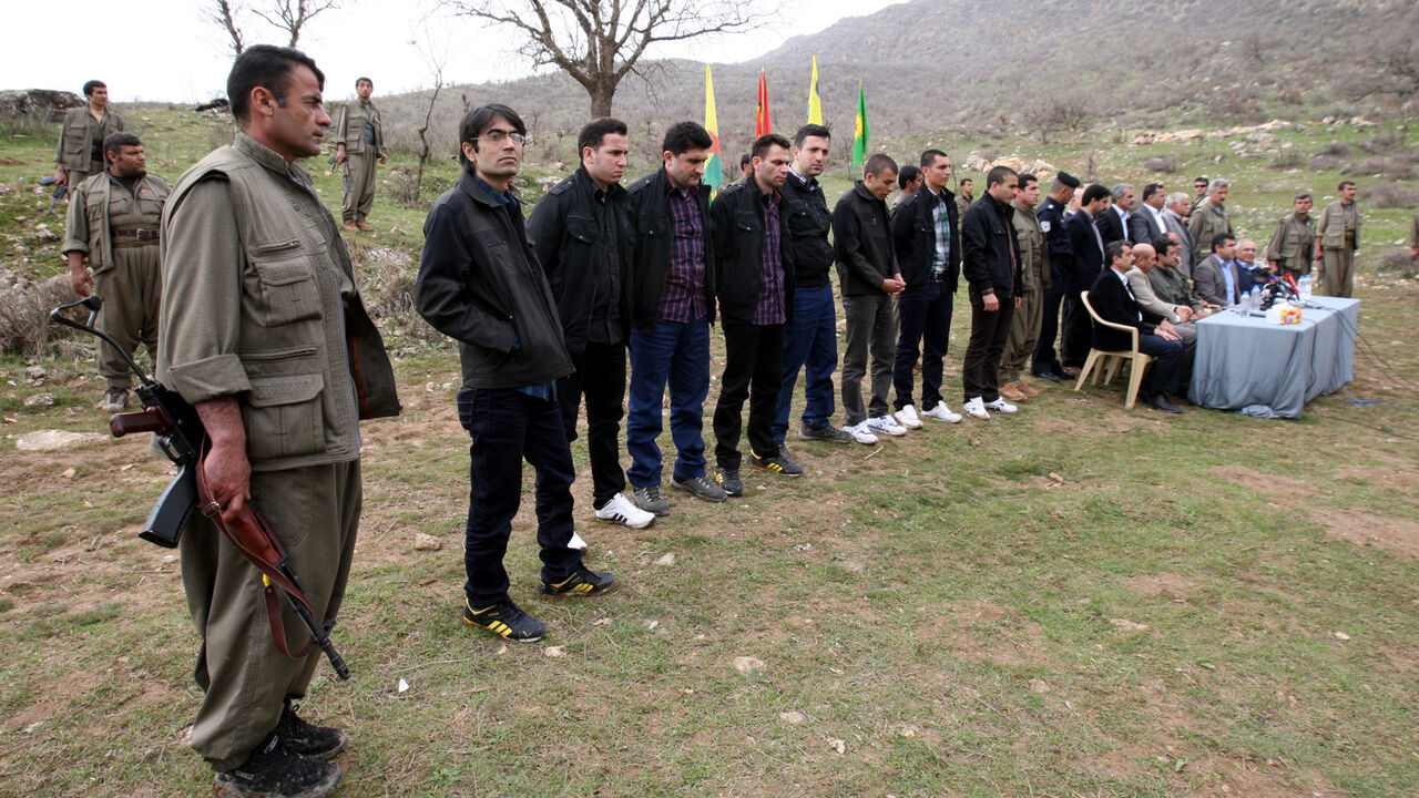 The eight Turkish prisoners are seen as they are released in the northern Iraqi city of Dohuk, March 13, 2013. Turkish Kurd militants freed a group of Turkish soldiers and officials they had held in the mountains of northern Iraq for more than a year on Wednesday, the first concrete step in efforts to end their 28-year-old insurgency. The six soldiers, a police officer and a local official looked in good health and wore clean clothes as they were handed to a delegation of Turkish rights activists and pro-Ku