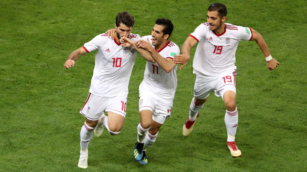Soccer Football - World Cup - Group B - Iran vs Portugal - Mordovia Arena, Saransk, Russia - June 25, 2018   Iran's Karim Ansarifard celebrates scoring their first goal with Vahid Amiri and Majid Hosseini    REUTERS/Lucy Nicholson     TPX IMAGES OF THE DAY - RC15E3C90680