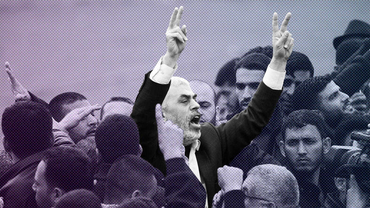 Islamist Hamas movement leader Yahya Sinwar (C) shouts slogans and flashes the victory gesture as he takes part in a tent city protest near the border with Israel east of Jabalia in the northern Gaza strip on March 30, 2018 to commemorate Land Day.
Land Day marks the killing of six Arab Israelis during 1976 demonstrations against Israeli confiscations of Arab land. / AFP PHOTO / Mohammed ABED        (Photo credit should read MOHAMMED ABED/AFP/Getty Images)