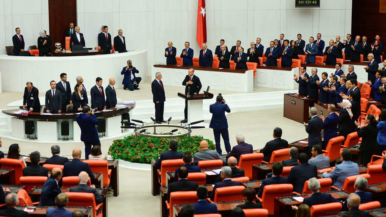 ANKARA, TURKEY - JULY 9: Turkey's President Recep Tayyip Erdogan receives his oath as he is sworns as Turkey's first Executive President at the Turkish parliament on July 9, 2018 in Ankara, Turkey. President Erdogan was sworn in during a parliamentary meeting and later an inauguration ceremony attended by a number of foreign leaders and dignitaries. President Erdogan secured another five year term and increased powers after winning 52.5 percent of the vote in the June 24 snap presidential and parliamentary 