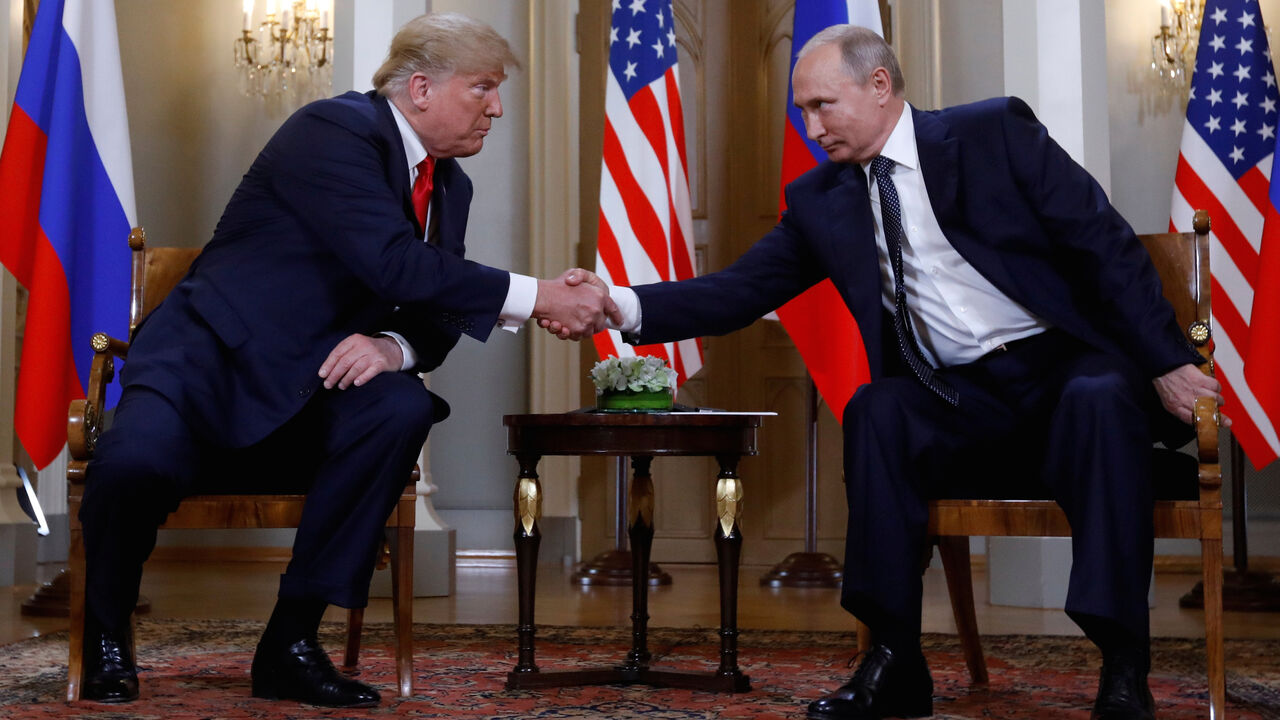 U.S. President Donald Trump and Russia's President Vladimir Putin shake hands as they meet in Helsinki, Finland July 16, 2018. REUTERS/Kevin Lamarque     TPX IMAGES OF THE DAY - RC19BE6D3090