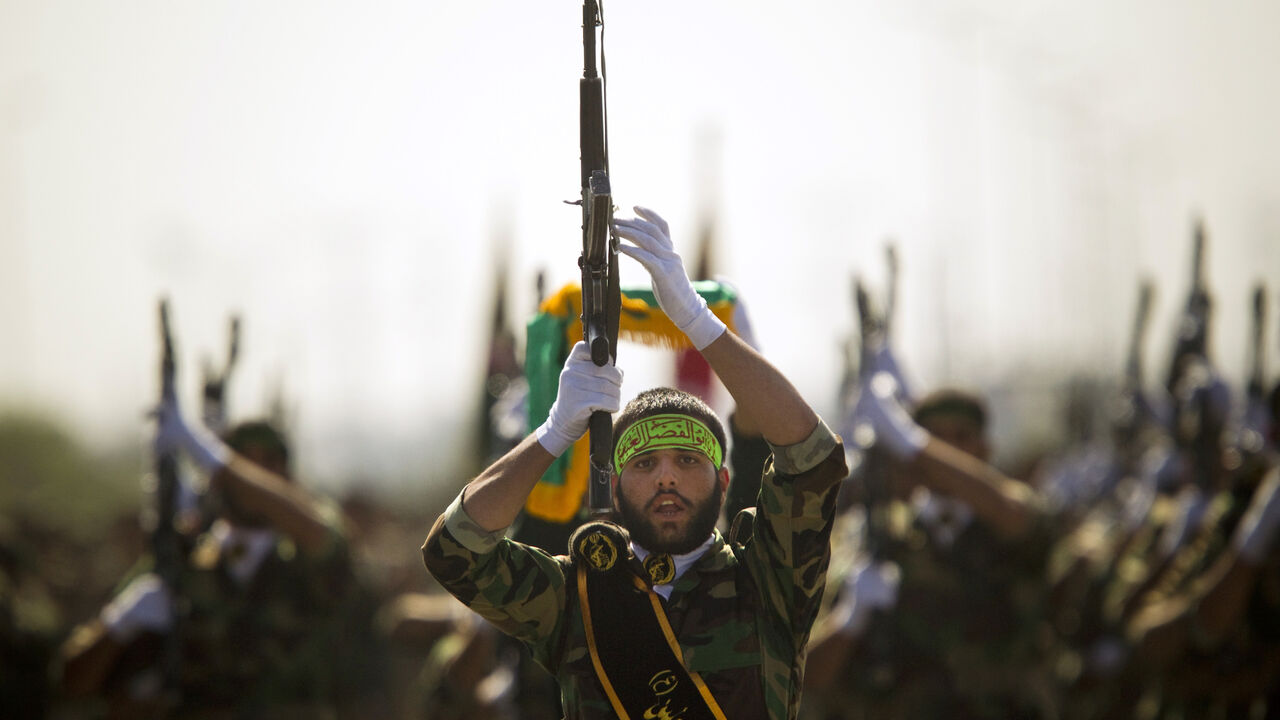 EDITORS' NOTE: Reuters and other foreign media are subject to Iranian restrictions on their ability to report, film or take pictures in Tehran.

Members of Iran's Basij militia march during a parade to commemorate the anniversary of the Iran-Iraq war (1980-88), in Tehran September 22, 2010. Iranian leaders hoping to lift morale at a time of rising prices, food shortages and threats of attack from Israel, are drawing on memories of another era when people united against a common foe: Saddam Hussein's Iraq.