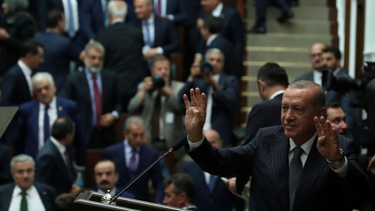 Turkish President Tayyip Erdogan greets members of parliament from his ruling AK Party (AKP) during a meeting at the Turkish parliament in Ankara, Turkey, October 2, 2018. REUTERS/Umit Bektas - RC18F32A2FE0