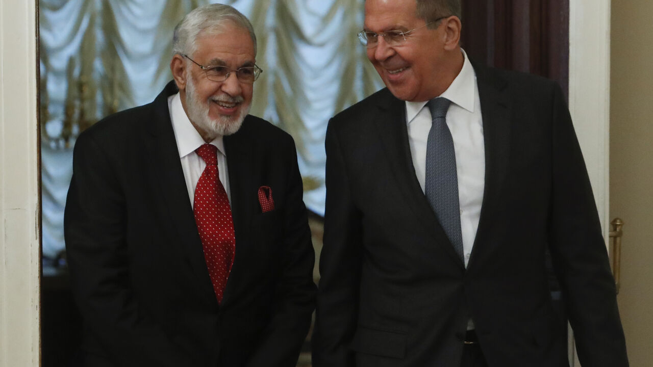 Russia's Foreign Minister Sergei Lavrov and Libya's Foreign Minister Mohamed Taher Siala enter a hall during a meeting in Moscow, Russia December 12, 2017. REUTERS/Sergei Karpukhin - UP1EDCC0RKC6P