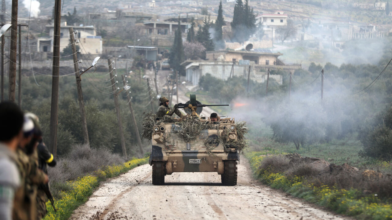 A Turkish-backed Free Syrian Army fighter fires from a tank in Rajo, Syria March 3, 2018. REUTERS/Khalil Ashawi - RC140AB204D0