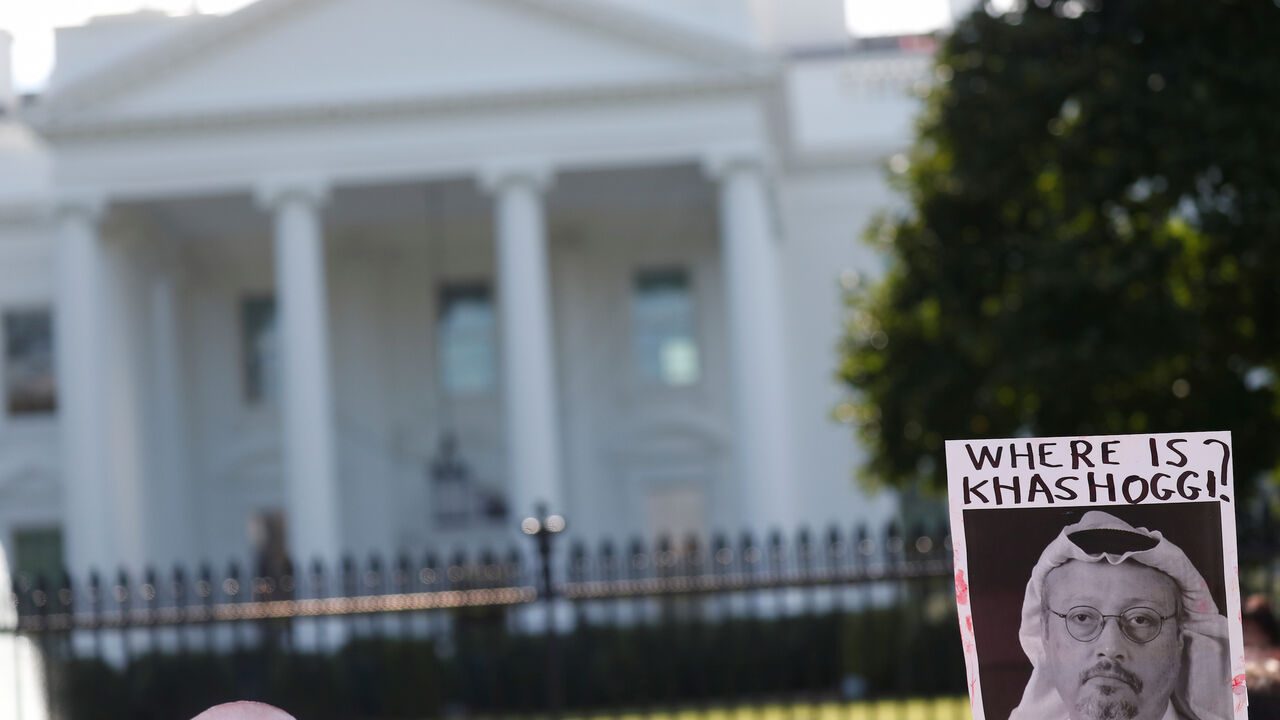 An activist holds an image of missing Saudi journalist Jamal Khashoggi during a demonstration calling for sanctions against Saudi Arabia and to protest Khashoggi's disappearance, outside the White House in Washington, U.S., October 19, 2018. REUTERS/Leah Millis - RC1F626030D0