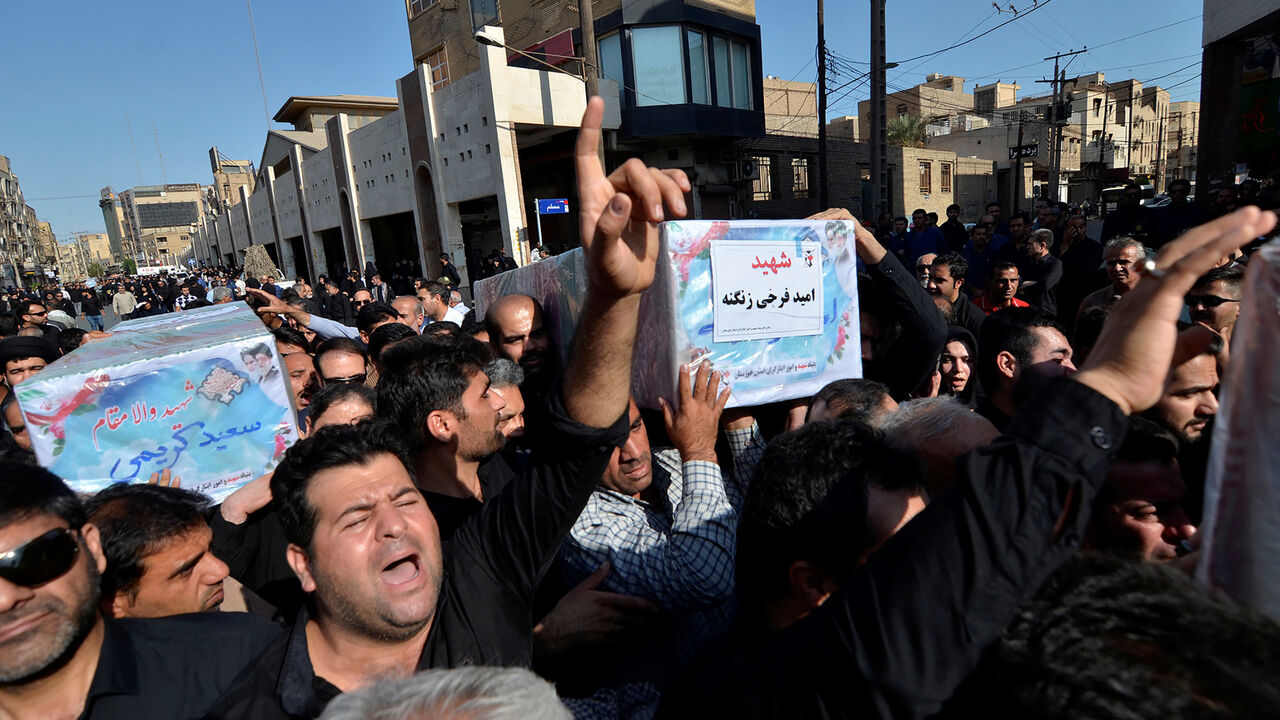 People carry coffins during a funeral of the victims of assault that killed 25 people, in the streets of the southwestern Iranian city of Ahvaz, Iran September 24, 2018. Tasnim News Agency/via REUTERS ATTENTION EDITORS - THIS PICTURE WAS PROVIDED BY A THIRD PARTY. - RC18F3BB4390