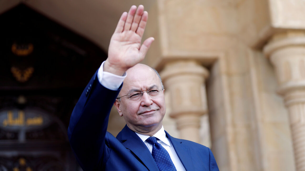 Barham Salih, Iraq's newly elected President greets Iraq's outgoing President Fuad Masum (not pictured) at the end of a handover ceremony at Salam Palace in Baghdad, Iraq October 3, 2018. REUTERS/Thaier Al-Sudani - RC1C2A8CDD30