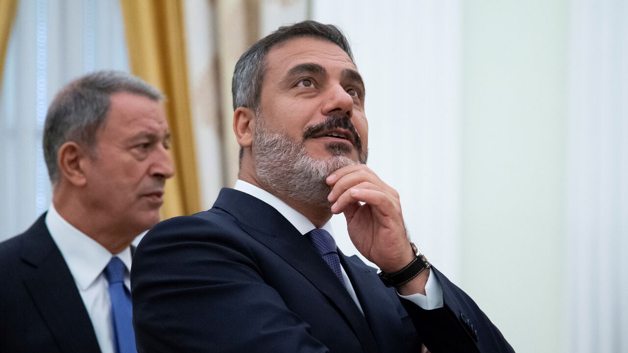 Turkish Defense Minister Hulusi Akar and intelligence chief Hakan Fidan are seen before a meeting with Russian President Vladimir Putin in the Kremlin in Moscow, Russia August 24, 2018.  Alexander Zemlianichenko/Pool via REUTERS - RC1992C13F10