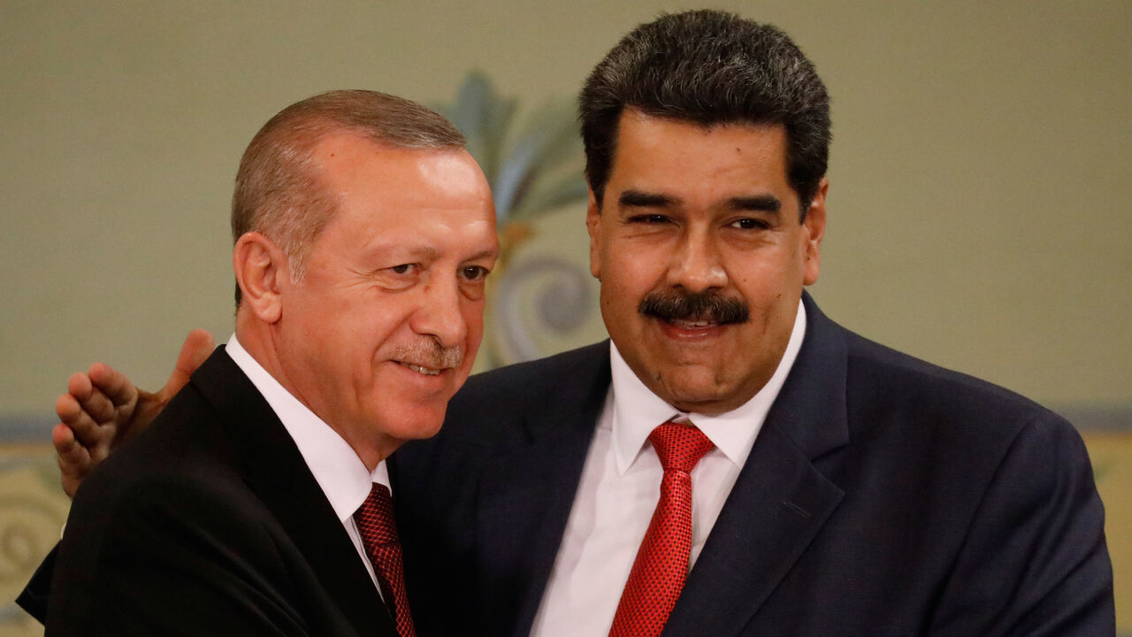 Turkish President Tayyip Erdogan and Venezuela's President Nicolas Maduro attend a news conference after an agreement-signing ceremony between Turkey and Venezuela at Miraflores Palace in Caracas, Venezuela December 3, 2018. REUTERS/Manaure Quintero - RC149F4F7600