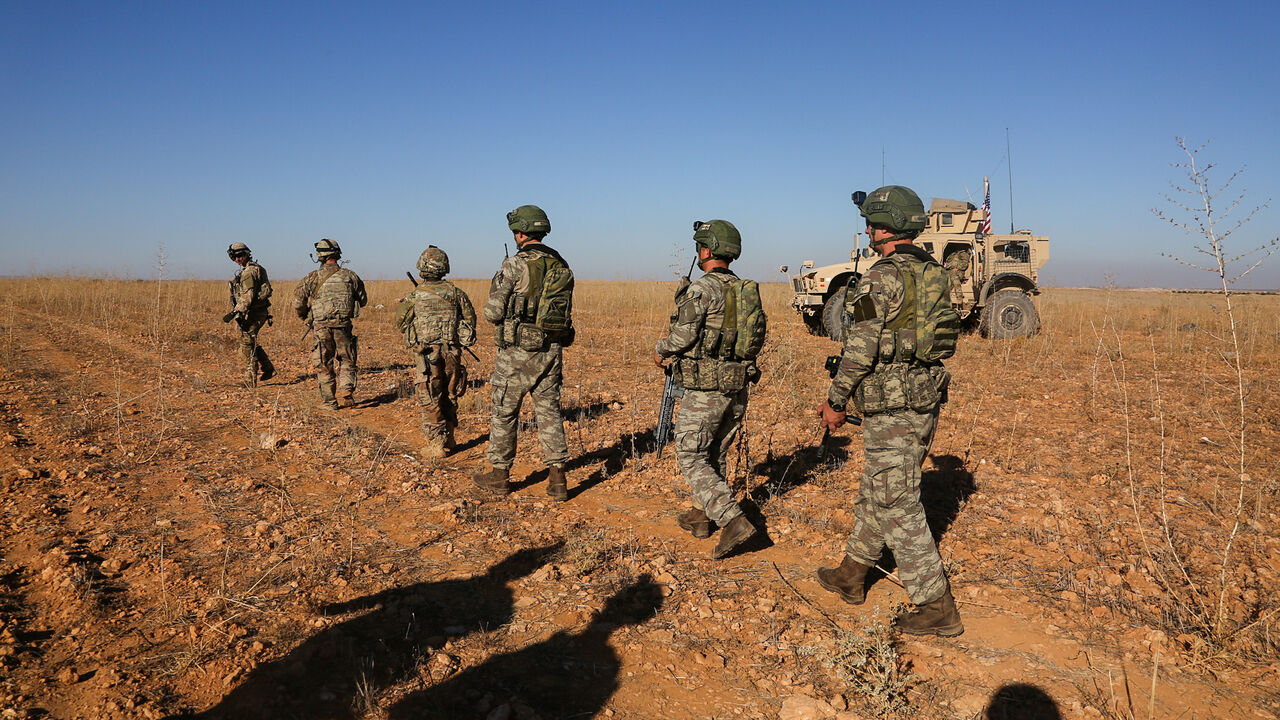 U.S. and Turkish soldiers conduct the first-ever combined joint patrol outside Manbij, Syria, November 1, 2018. Picture taken November 1, 2018. Courtesy Arnada Jones/U.S. Army/Handout via REUTERS  ATTENTION EDITORS - THIS IMAGE HAS BEEN SUPPLIED BY A THIRD PARTY. - RC17C4EA11D0