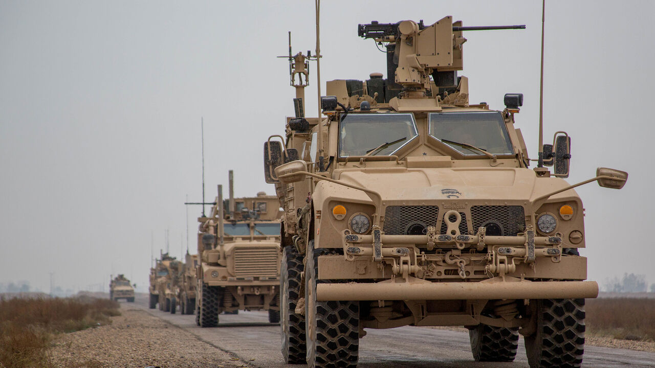 A Coalition convoy of U.S. led international coalition against the Islamic State of Iraq and the Levant (ISIL) stops to test fire their M2 machine guns and MK19 grenade launcher in the Middle Euphrates River Valley in the Deir ez-Zor province, Syria, November 22, 2018. Picture taken November 22, 2018. Courtesy Matthew Crane/U.S. Army/Handout via REUTERS ATTENTION EDITORS - THIS IMAGE HAS BEEN SUPPLIED BY A THIRD PARTY. - RC168AA782C0