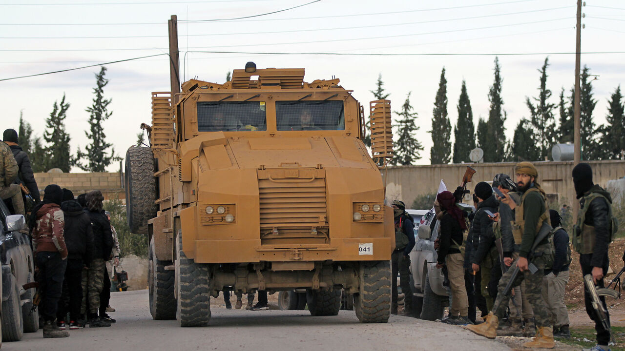 Turkish soldiers ride a military vehicle at Manbij countryside, Syria December 28, 2018. REUTERS/Khalil Ashawi - RC1A2163F930