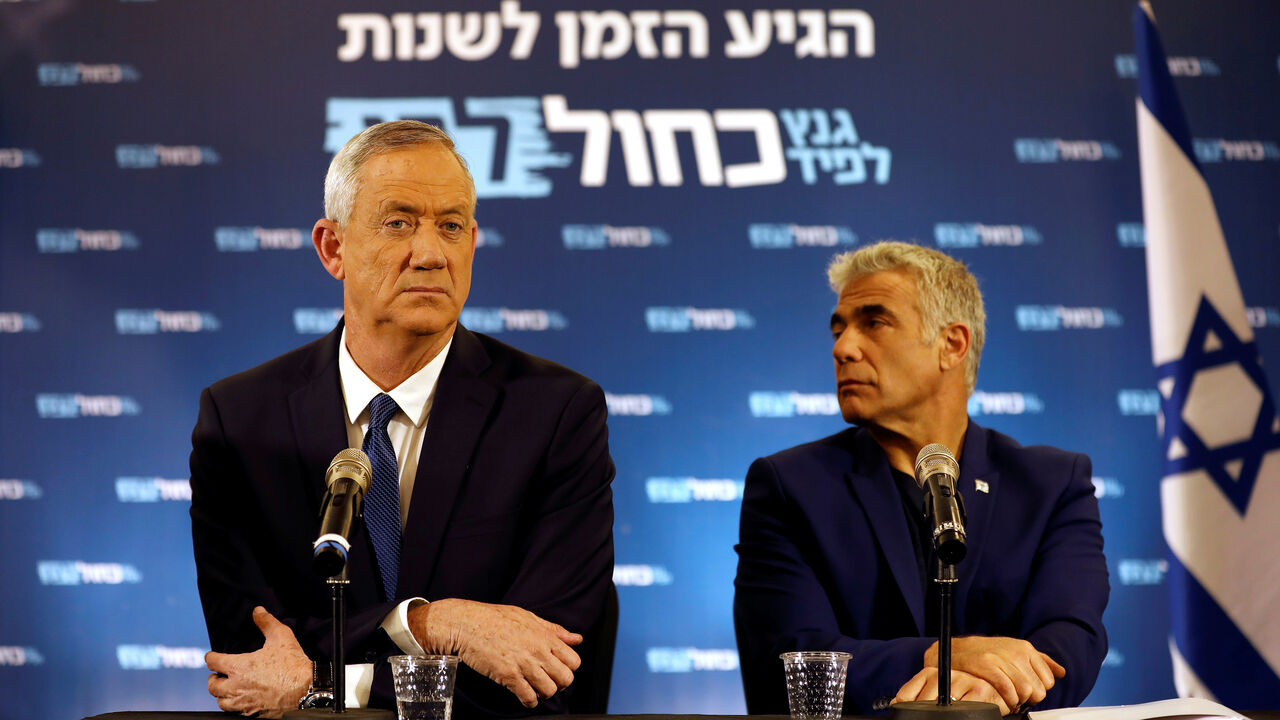 Benny Gantz and Yair Lapid, leaders of Blue and White party, sit during a news conference in Tel Aviv, Israel April 1, 2019. REUTERS/Corinna Kern - RC1BFEF7E3E0
