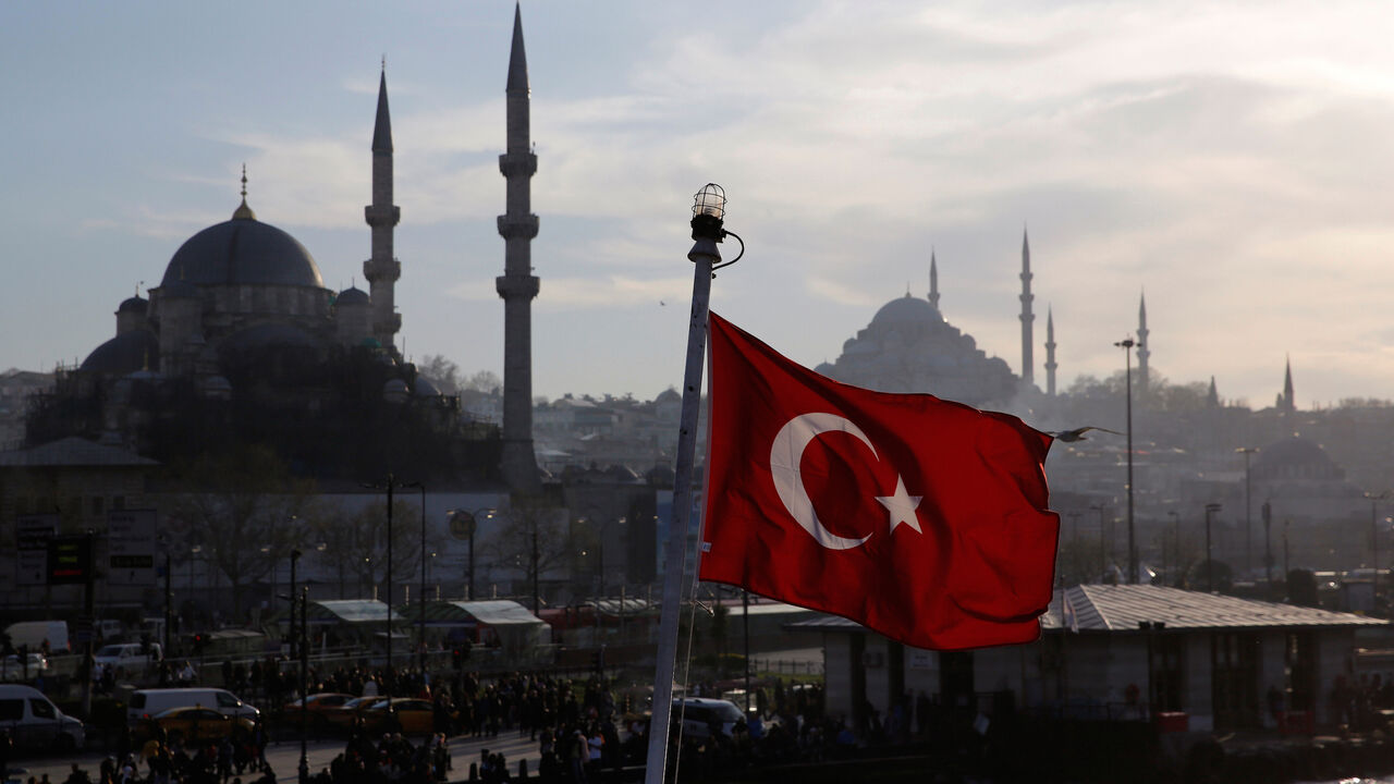 A Turkish flag, with the New and the Suleymaniye mosques in the background, flies on a passenger ferry in Istanbul, Turkey, April 11, 2019. REUTERS/Murad Sezer - RC1B6C6E4270