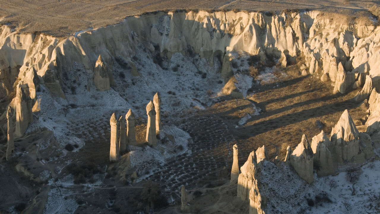 An aerial view of Love Valley is seen from a hot air balloon in Cappadocia December 12, 2008. Cappadocia is a popular tourist destination in Turkey renowned for unusual rock formations and rock-caved churches. Picture taken December 12, 2008. REUTERS/Tan Shung Sin (TURKEY) - GM1E4CI1QPA01