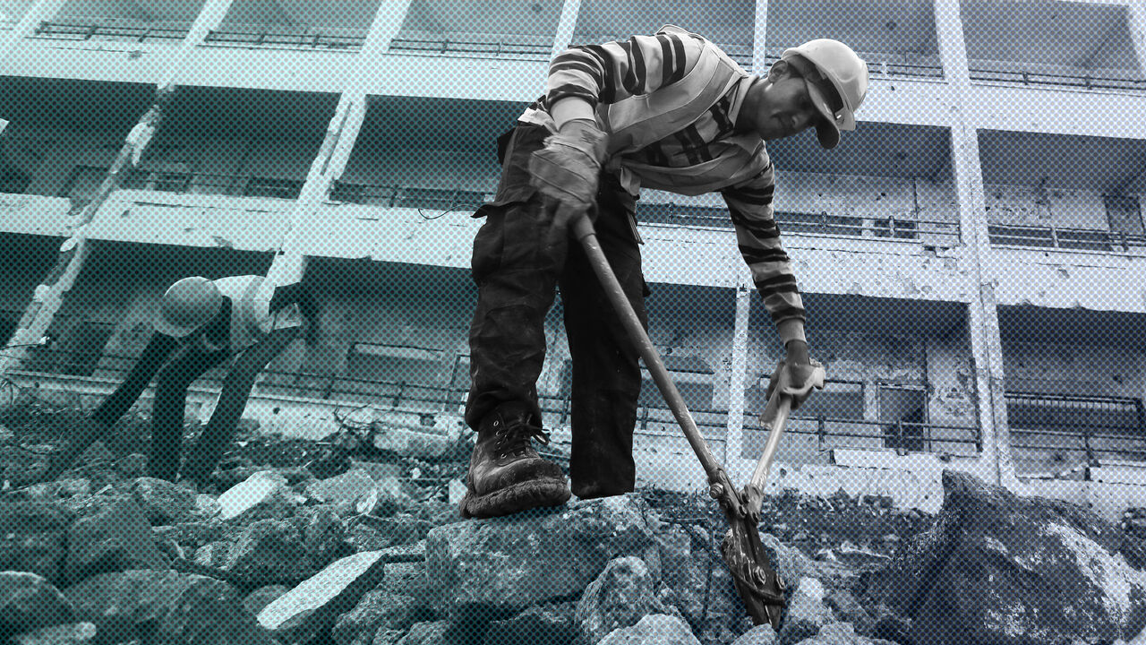 Palestinian workers clear the rubble of a school that witnesses said was destroyed by Israeli shelling during the most recent conflict between Israel and Hamas, in the east of Gaza City December 3, 2014. According to housing minister Mufeed al-Hasayna, Gaza needs 8,000 tonnes of cement a day to meet demand. A new system set up with the United Nations to comply with Israeli requirements lets through at most 2,000, he said. At that rate, reconstruction would take more than 30 years, said Hasayna, one of four 