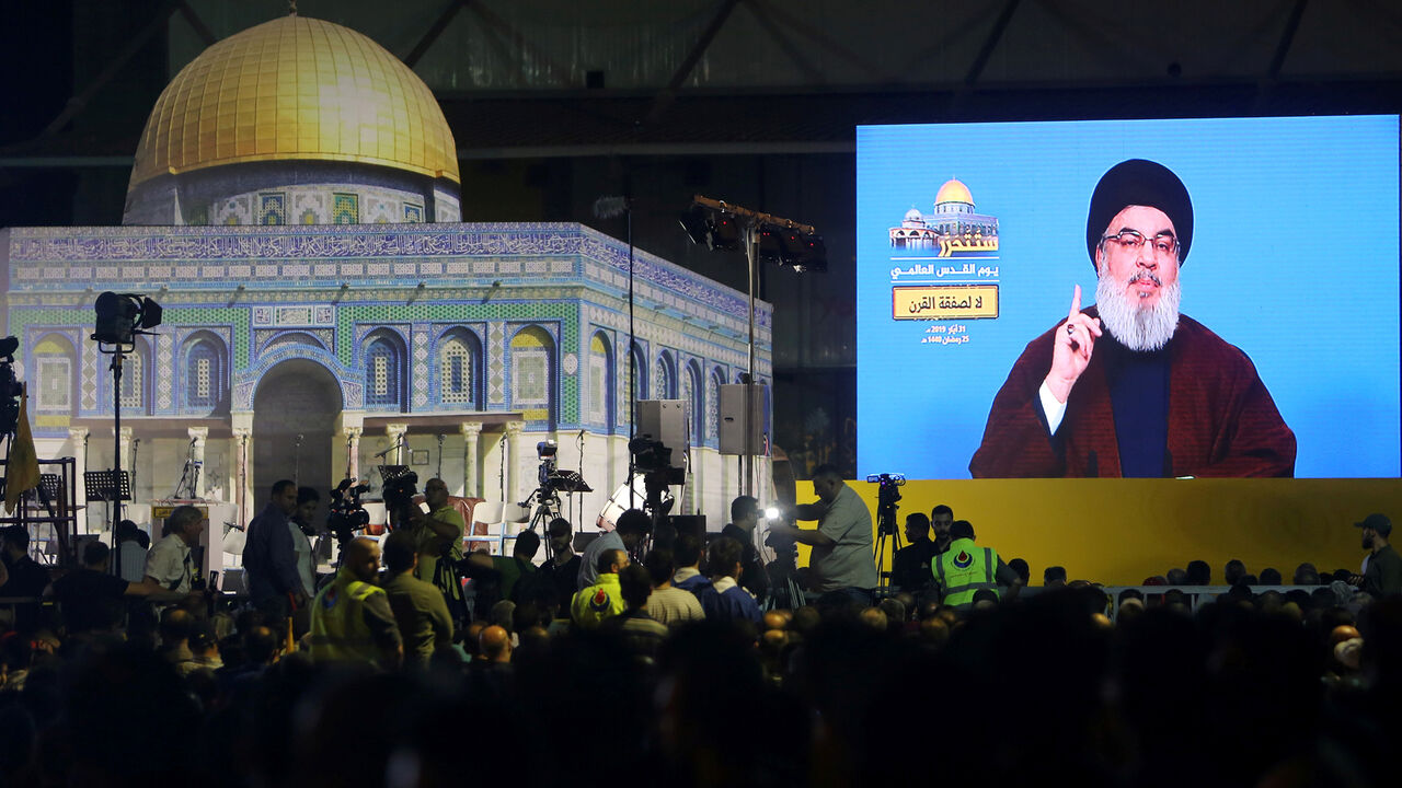 Lebanon's Hezbollah leader Sayyed Hassan Nasrallah addresses his supporters via a screen during a rally marking al-Quds Day, (Jerusalem Day) in Beirut, Lebanon May 31, 2019. REUTERS/Aziz Taher - RC196CD3C190