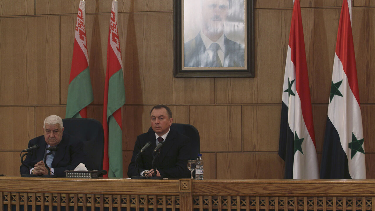 Syria's Foreign Minister Walid al-Moualem (R) and Belarus' Foreign Minister Vladimir Makei attend a news conference in Damascus February 9, 2015. Syria will not compromise on its sovereignty by allowing foreign troops on its soil to fight Islamic State militants, Walid al-Moualem said during a news conference on Monday. REUTERS/Omar Sanadiki (SYRIA - Tags: POLITICS CONFLICT) - GM1EB291NOL01