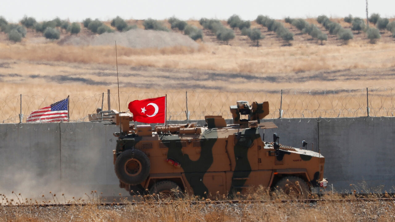 A Turkish military vehicle returns after a joint U.S.-Turkey patrol in northern Syria, as it is pictured from near the Turkish town of Akcakale, Turkey, September 8, 2019. REUTERS/Murad Sezer - RC1967E7F3C0