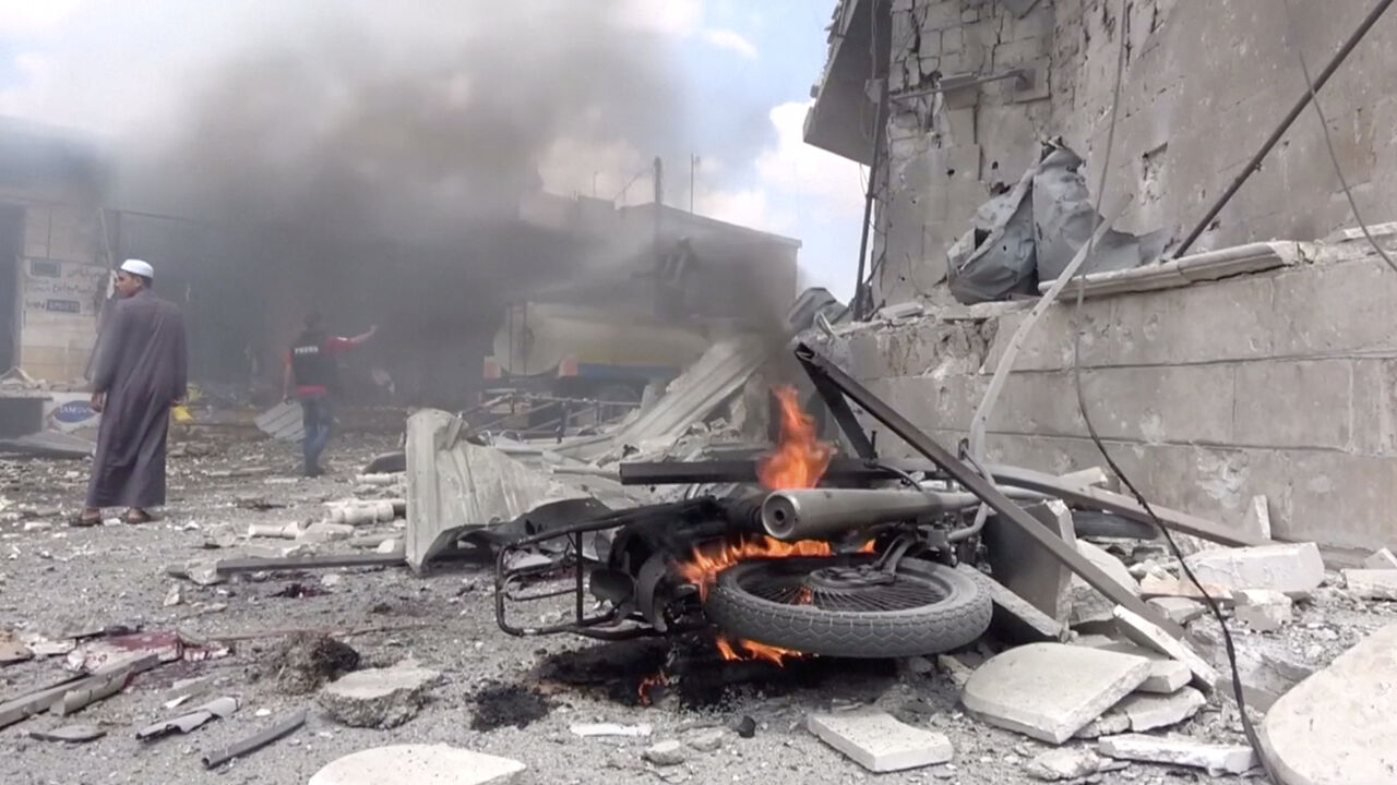A motorbike burns after an airstrike in this screen grab taken from a social media video said to be taken in Idlib, Syria on July 16, 2019. Picture taken July 16, 2019. White Helmets/social media via REUTERS THIS IMAGE HAS BEEN SUPPLIED BY A THIRD PARTY. - RC1FFC6630A0