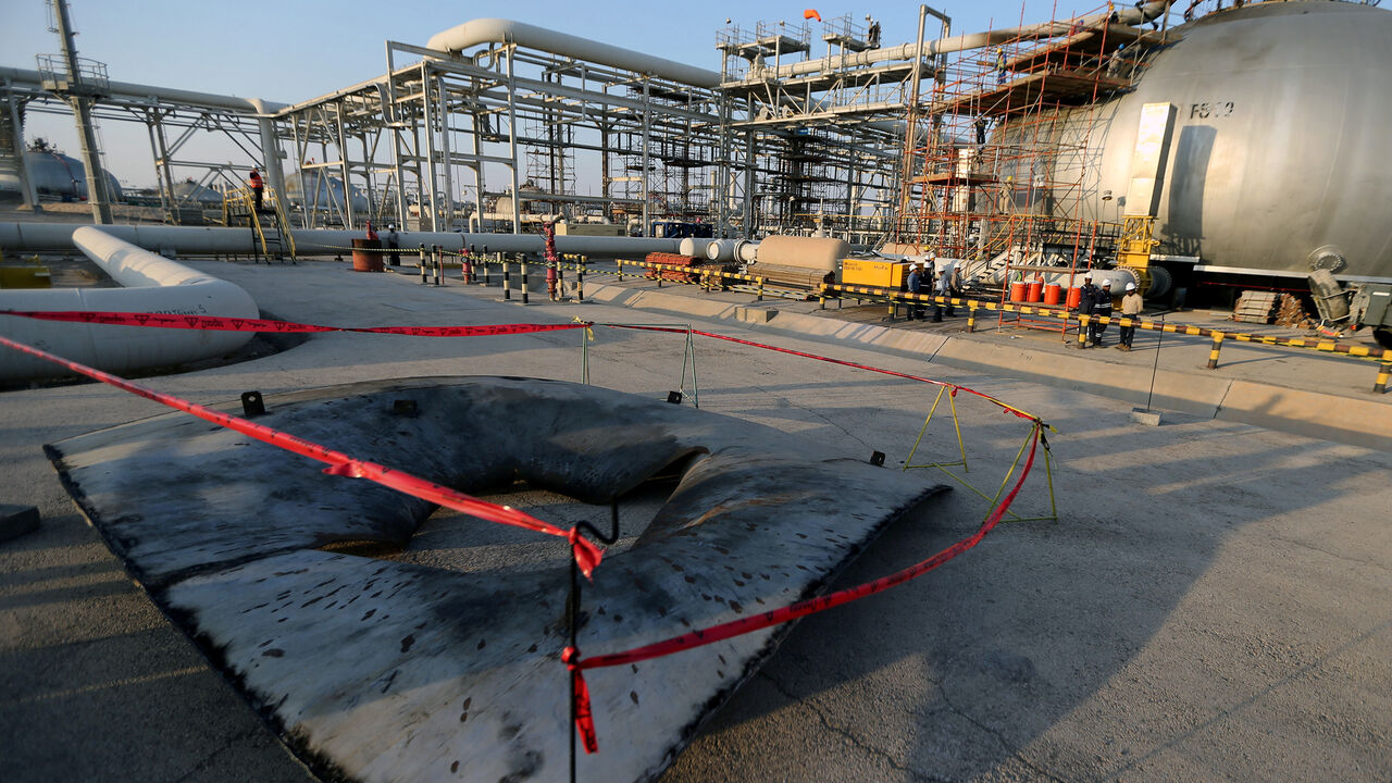 A metal part of a damaged tank is seen at the damaged site of Saudi Aramco oil facility in Abqaiq, Saudi Arabia, September 20, 2019. REUTERS/Hamad l Mohammed - RC1BC8385400