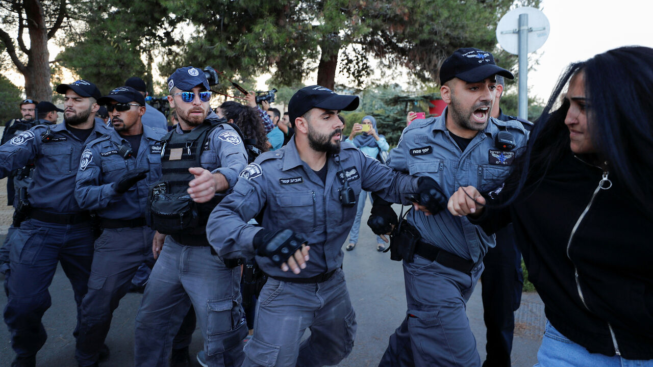 Palestinian demonstrator scuffles with Israeli security forces during a protest against Israel held after a detainee suspected of killing an Israeli teenager in a bomb attack was hospitalized during interrogation, in Jerusalem October 1, 2019. REUTERS/Ammar Awad - RC1AA435A860