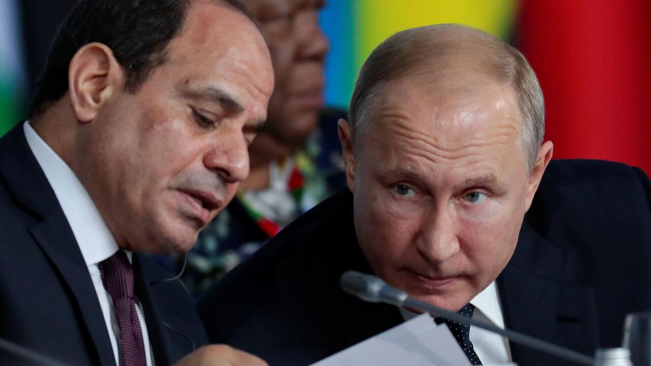 Egypt's President Abdel Fattah el-Sisi speaks with Russia's President Vladimir Putin during the first plenary session as part of the 2019 Russia-Africa Summit at the Sirius Park of Science and Art in Sochi, Russia, October 24, 2019. Sergei Chirikov/Pool via REUTERS - RC1AA9297200