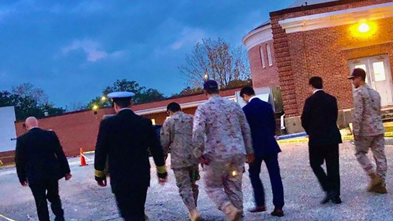Saudi Arabia Defense Attache Major General Fawaz Al Fawaz and his Embassy staff and other officials arrive to meet with the Saudi students who remain restricted to the Naval Air Station (NAS) Pensacola base by their Saudi commanding officer, in Pensacola, Florida, U.S. December 9, 2019. Picture taken December 9, 2019.  FBI Jacksonville/Handout via REUTERS  THIS IMAGE HAS BEEN SUPPLIED BY A THIRD PARTY. - RC2ISD9F1TE0