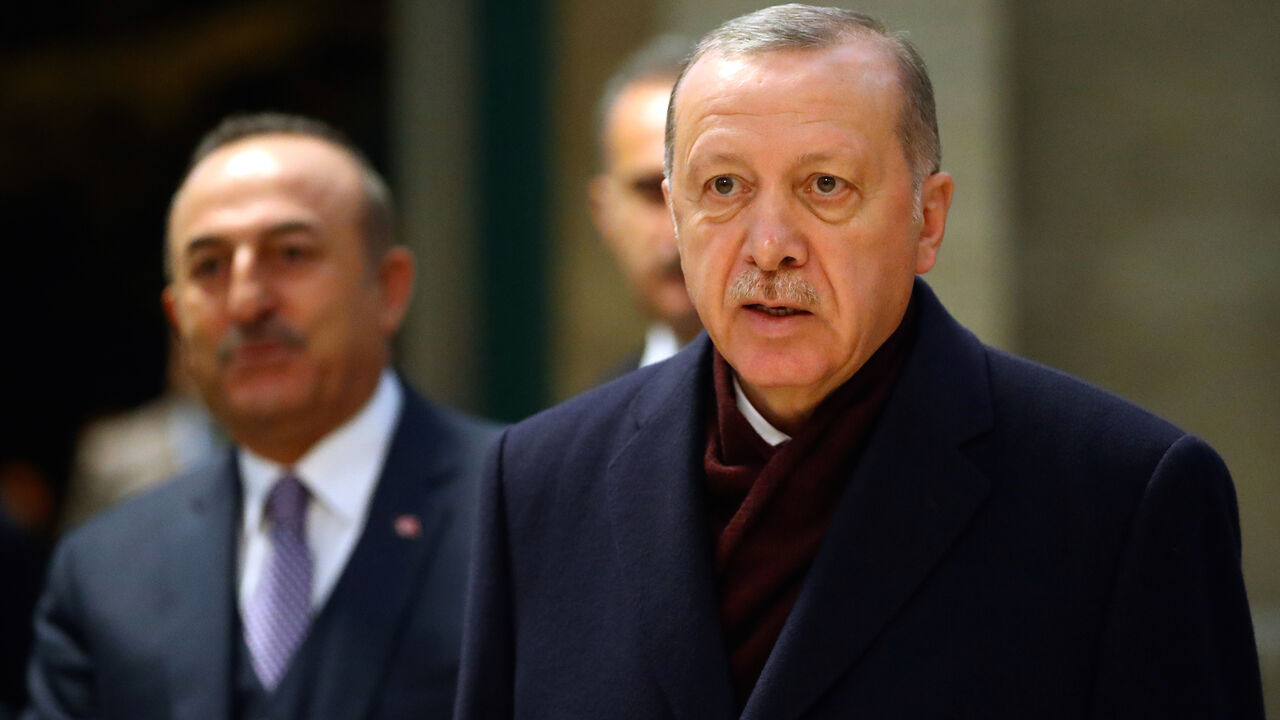 Turkey's President Recep Tayyip Erdogan speaks to media next to Foreign Minister Mevlut Cavusoglu after the Global Refugee Forum at the United Nations in Geneva, Switzerland, December 17, 2019, REUTERS/Denis Balibouse - RC24XD90WC3C