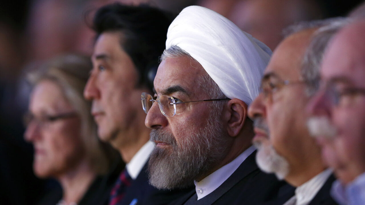 Japan's Prime Minister Shinzo Abe, Iran's President Hassan Rouhani and Iran's Foreign Minister Mohammad Javad Zarif (2nd L-2nd R) listen to a special address during the annual meeting of the World Economic Forum (WEF) in Davos January 22, 2014.                 REUTERS/Denis Balibouse (SWITZERLAND  - Tags: POLITICS BUSINESS)   - LR2EA1M1BK3KT