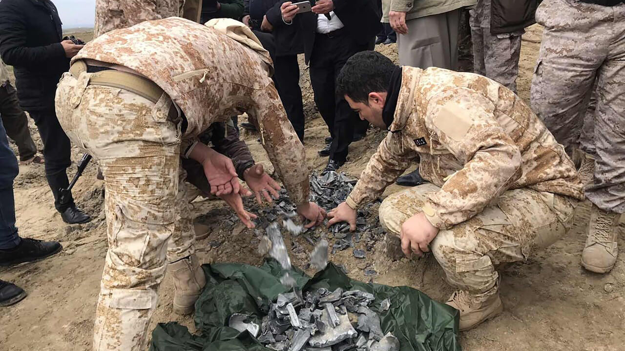 ERBIL, IRAQ - JANUARY 08: Iraqi security forces find and collect the pieces of missiles as they gather to inspect the site after Iran's Islamic Revolutionary Guard Corps (IRGC) targeted Ain al-Asad airbase in Iraq, a facility jointly operated by U.S. and Iraqi forces, at Bardarash district of Erbil in Iraq on January 08, 2020. (Photo by Azad Muhammed/Anadolu Agency via Getty Images)