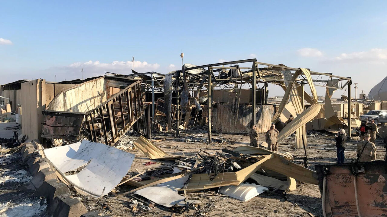 U.S. soldiers inspect the site where an Iranian missile hit at Ain al-Asad air base in Anbar province, Iraq January 13, 2020. REUTERS/John Davison - RC24FE9RIQUT