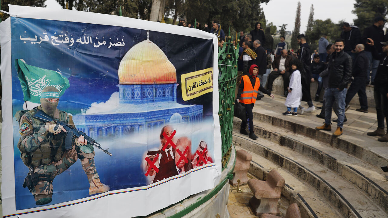 A banner placed by Hamas with a slogan reading in Arabic: " no to the deal of the century" (US-prosed peace plan) is pictured as Palestinian Muslim worshippers gather at the Al-Aqsa mosque compound in the Old City of Jerusalem, on February 14, 2020. (Photo by Ahmad GHARABLI / AFP) (Photo by AHMAD GHARABLI/AFP via Getty Images)
