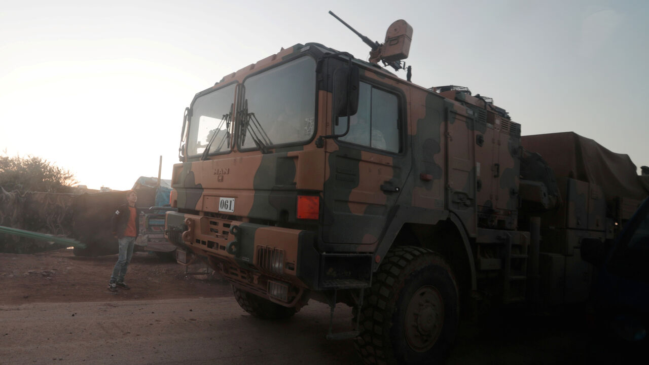Turkish military vehicles enter the Bab al-Hawa crossing at the Syrian-Turkish border, in Idlib governorate, Syria, February 9, 2020. REUTERS/Khalil Ashawi - RC2AXE9G6YVS